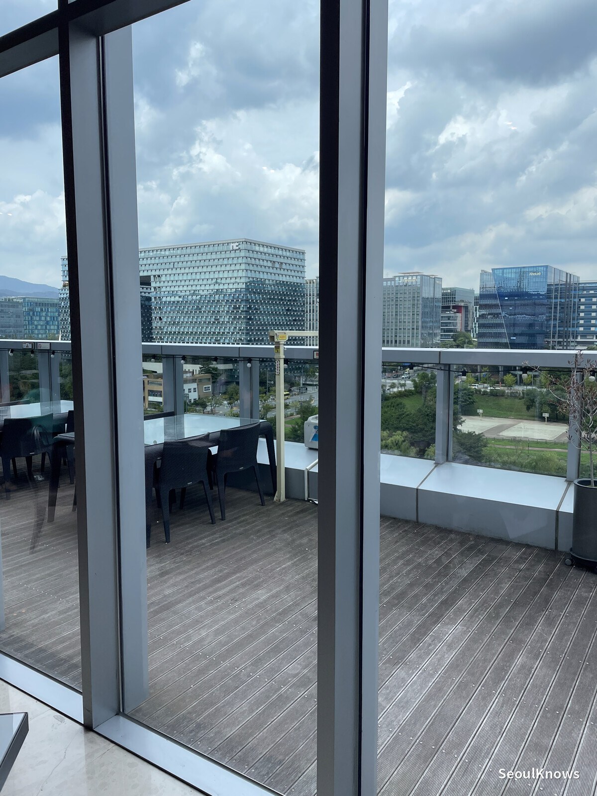 Outdoor terrace with wooden decking on the 8th floor at Courtyard by Marriott Seoul Pangyo