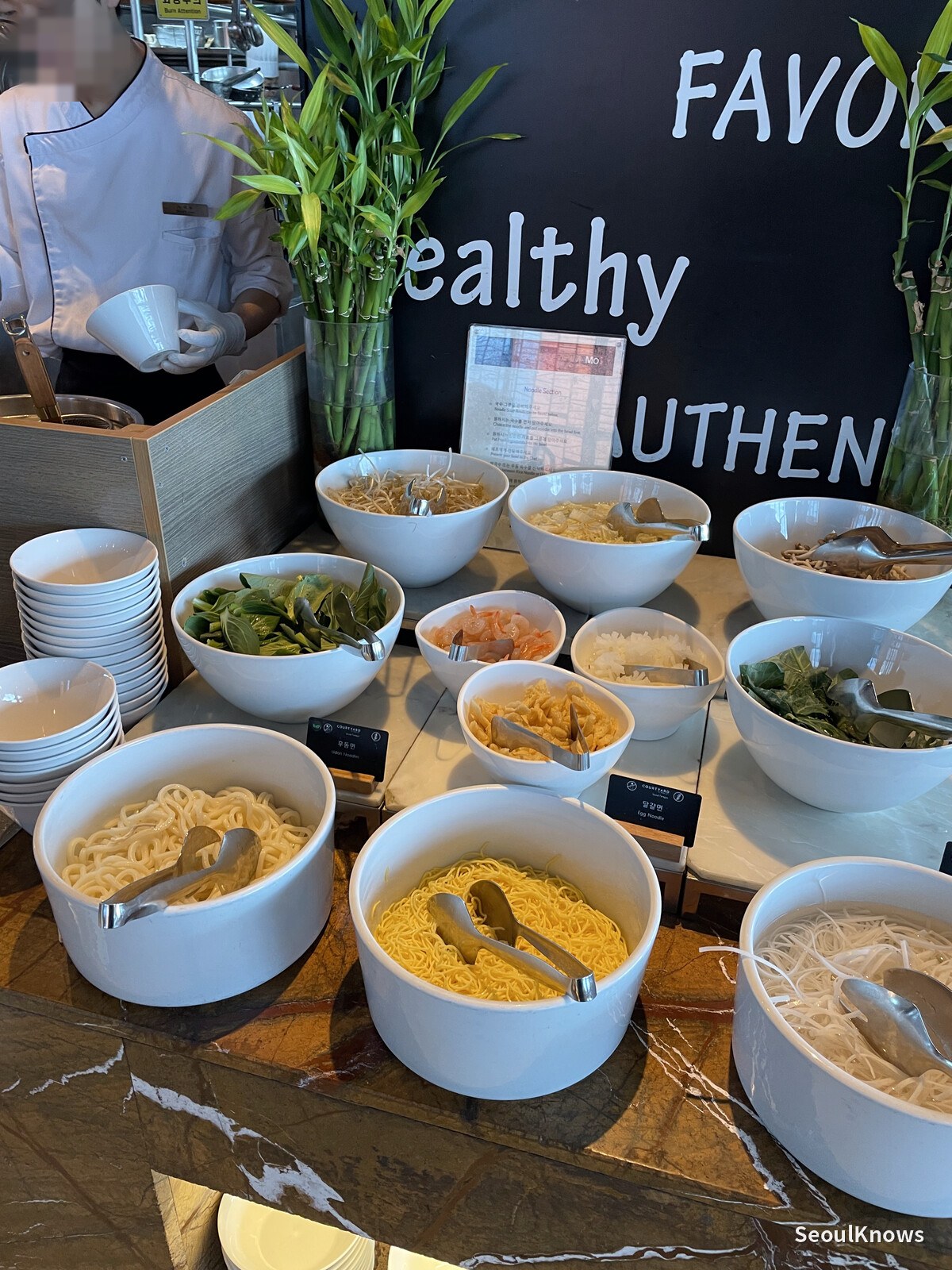 Made-to-order noodle station at MoMo Cafe with noodles and toppings laid out