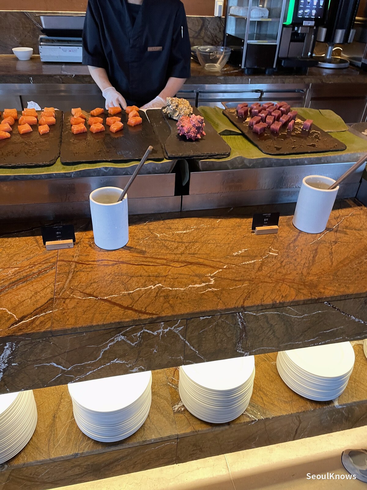 Staff slicing salmon to order at the MoMo Cafe seafood counter