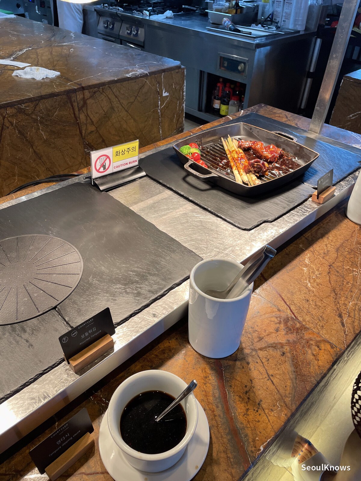 Skewers kept hot on a griddle at the MoMo Cafe buffet