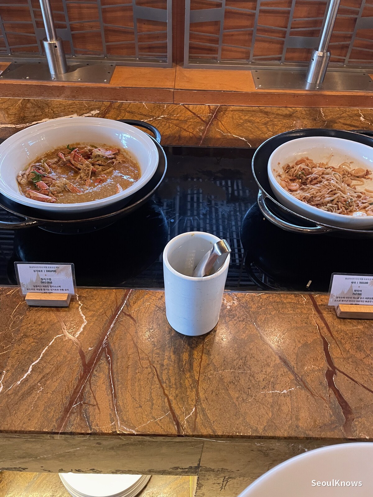 Chinese-style dishes in serving bowls at the buffet