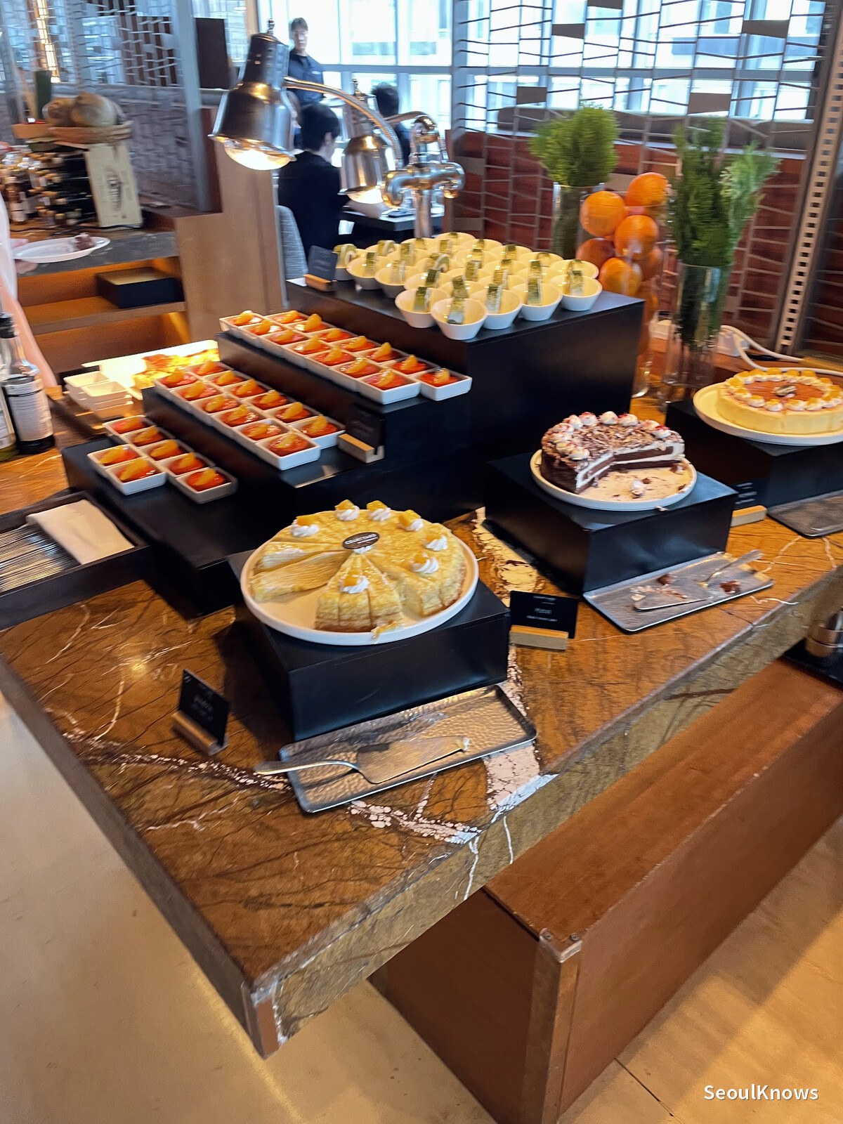 Dessert selection with tarts and cakes at MoMo Cafe