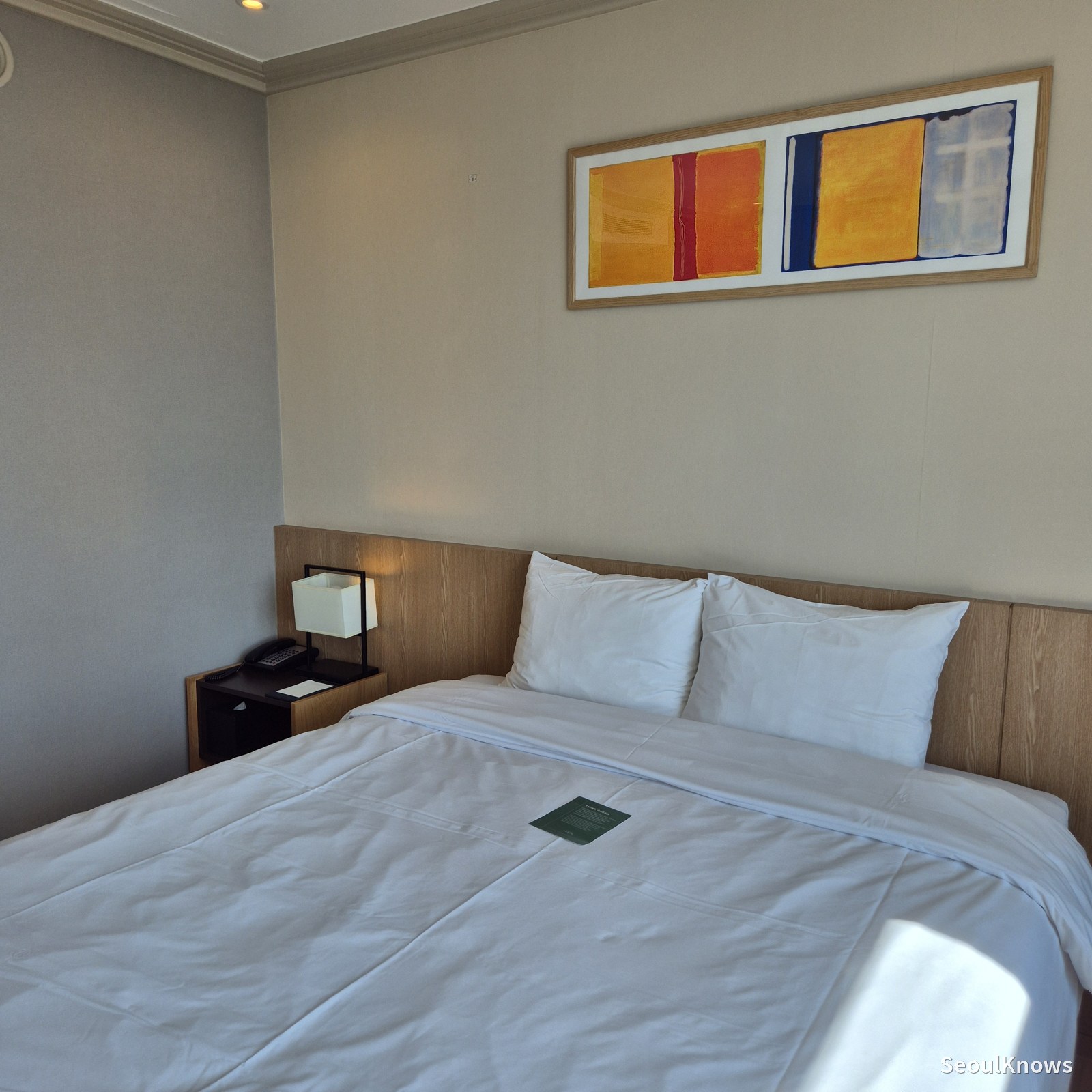Bed and artwork in a room