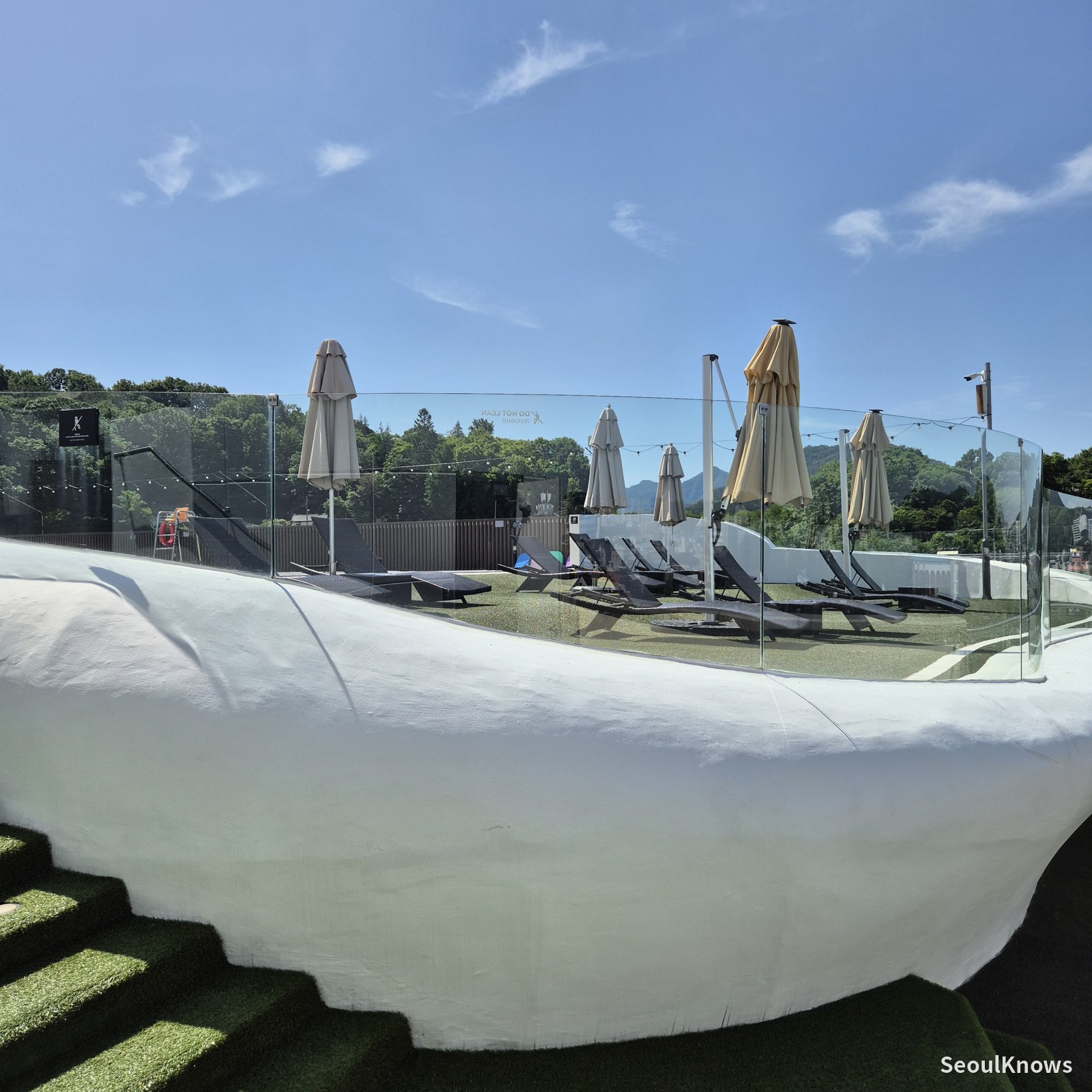 Rooftop pool deck with umbrellas