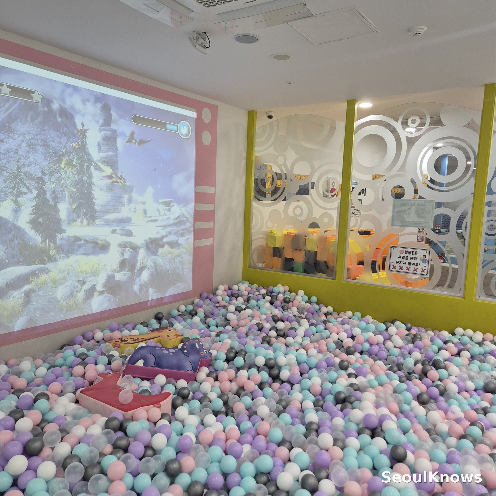 Large ball pit with interactive projection screen at Dogok indoor playground