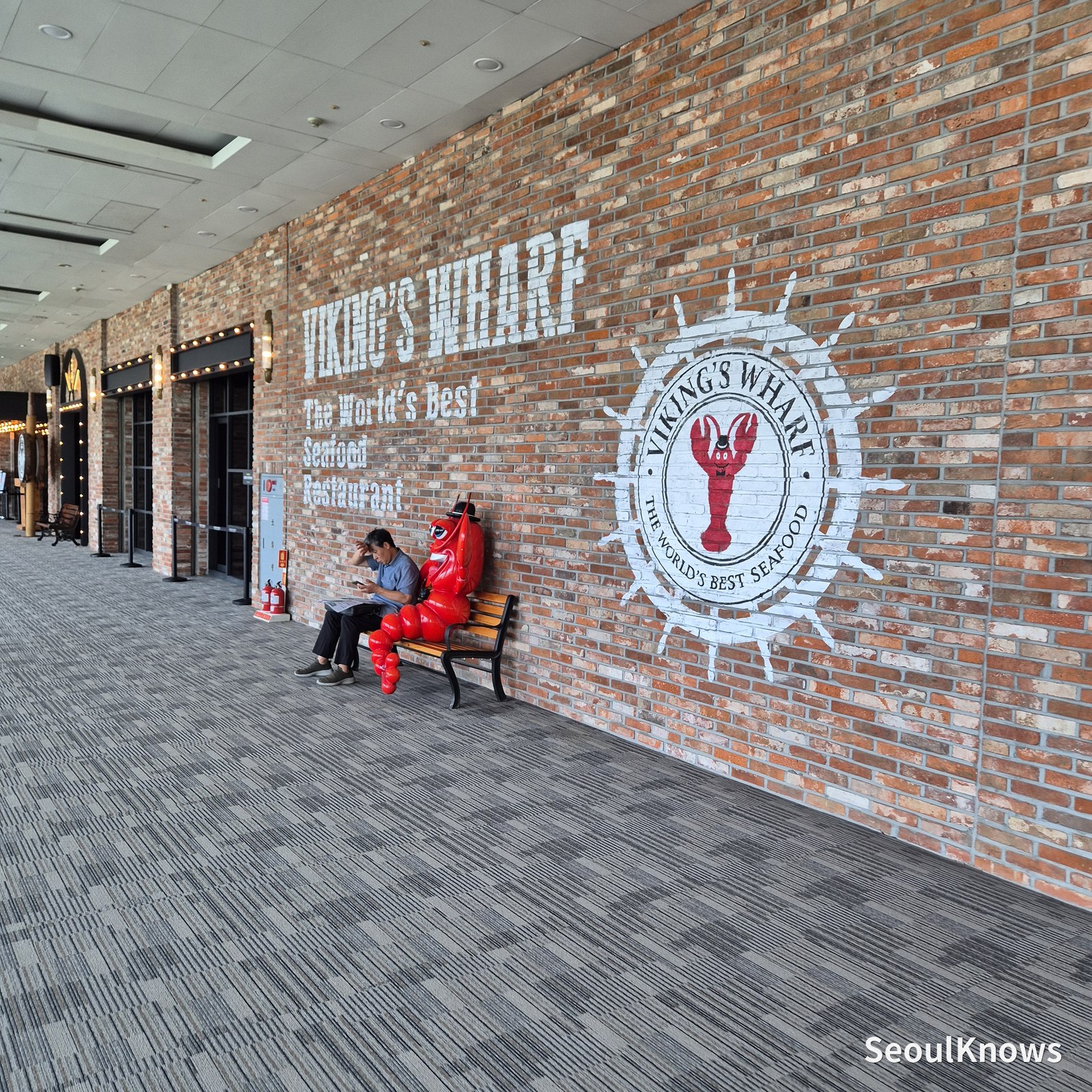 Viking's Wharf logo on the brick wall outside the COEX entrance