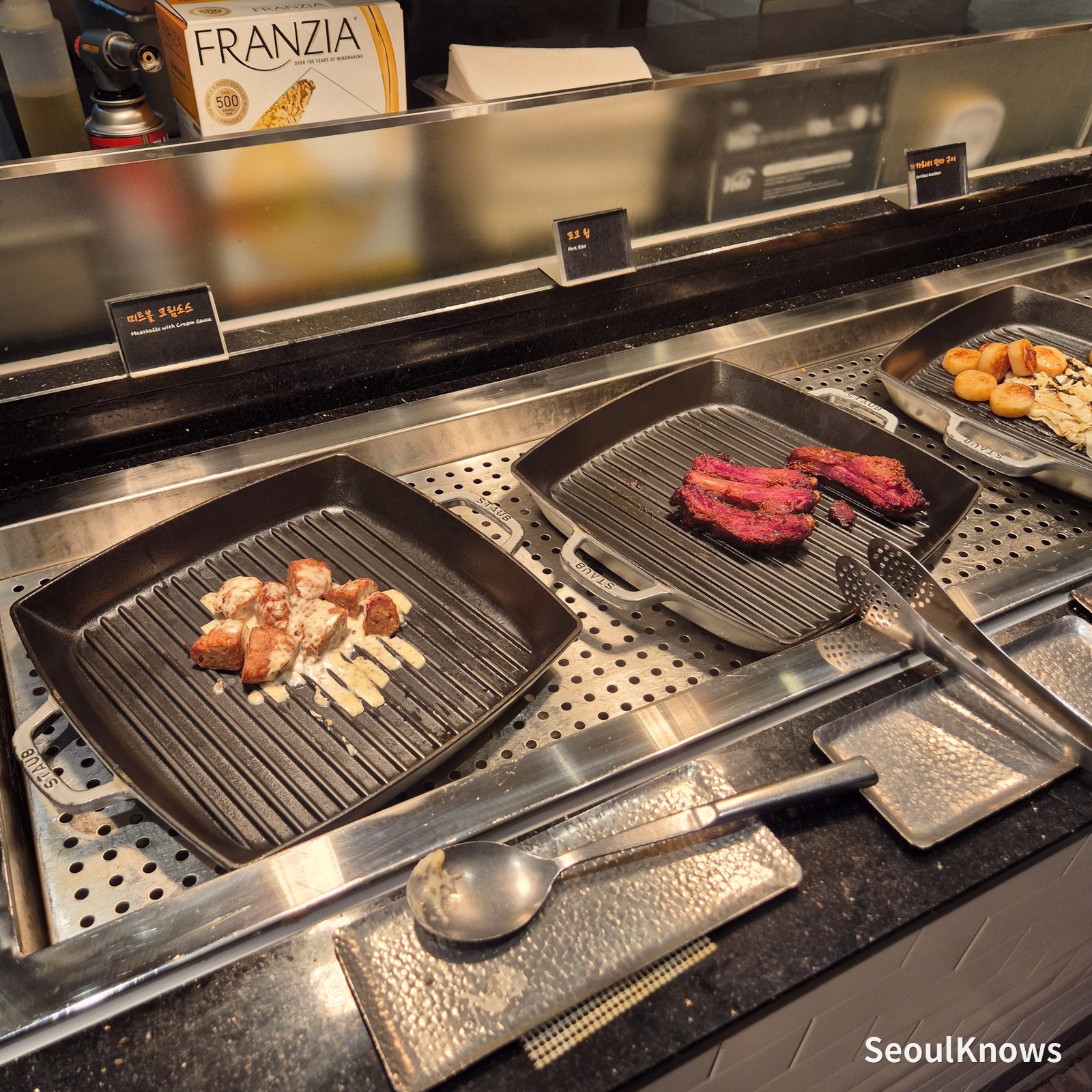 Butter-grilled abalone and scallops at the Viking's Wharf hot station