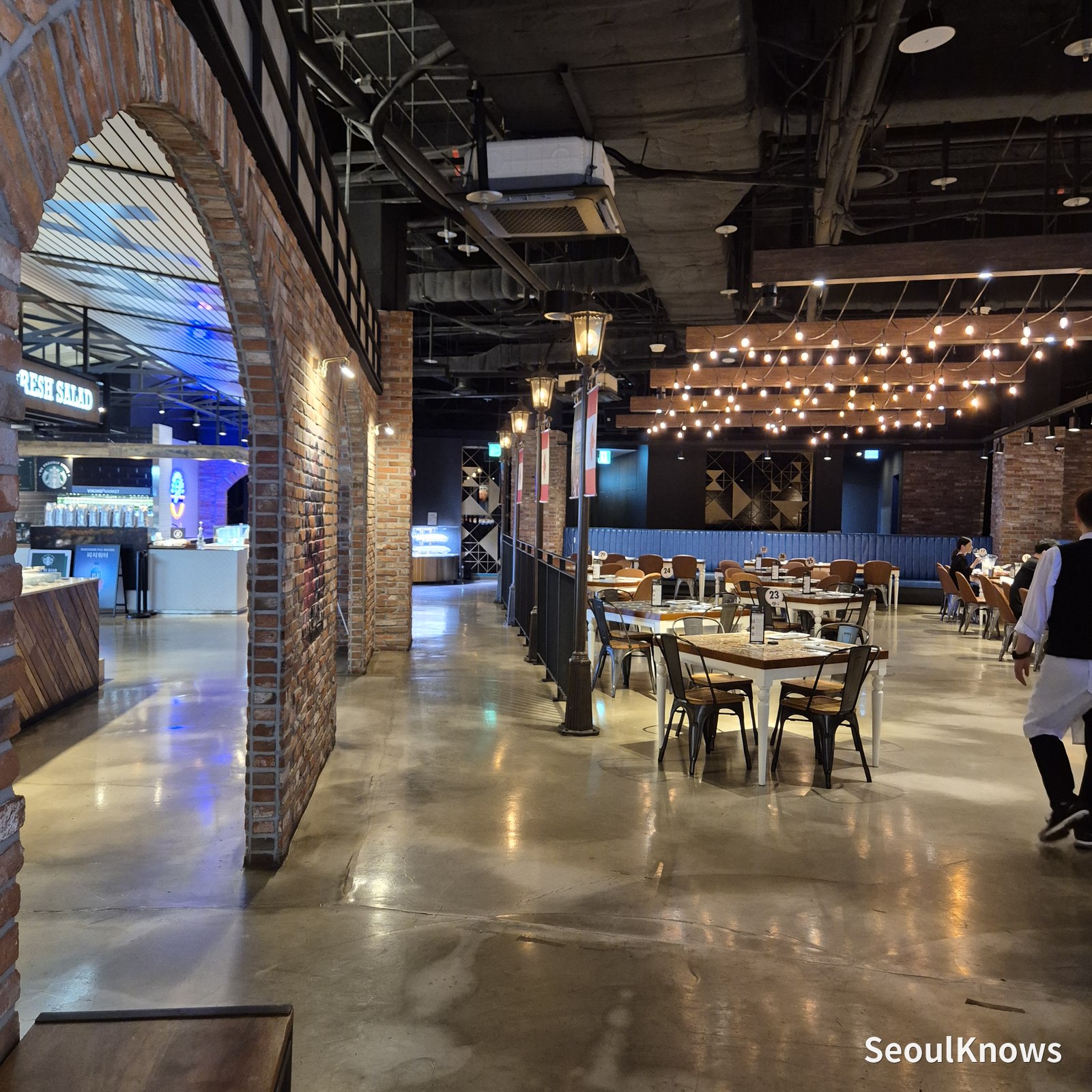 Interior of Viking's Wharf COEX showing brick walls, high ceilings and wide aisles