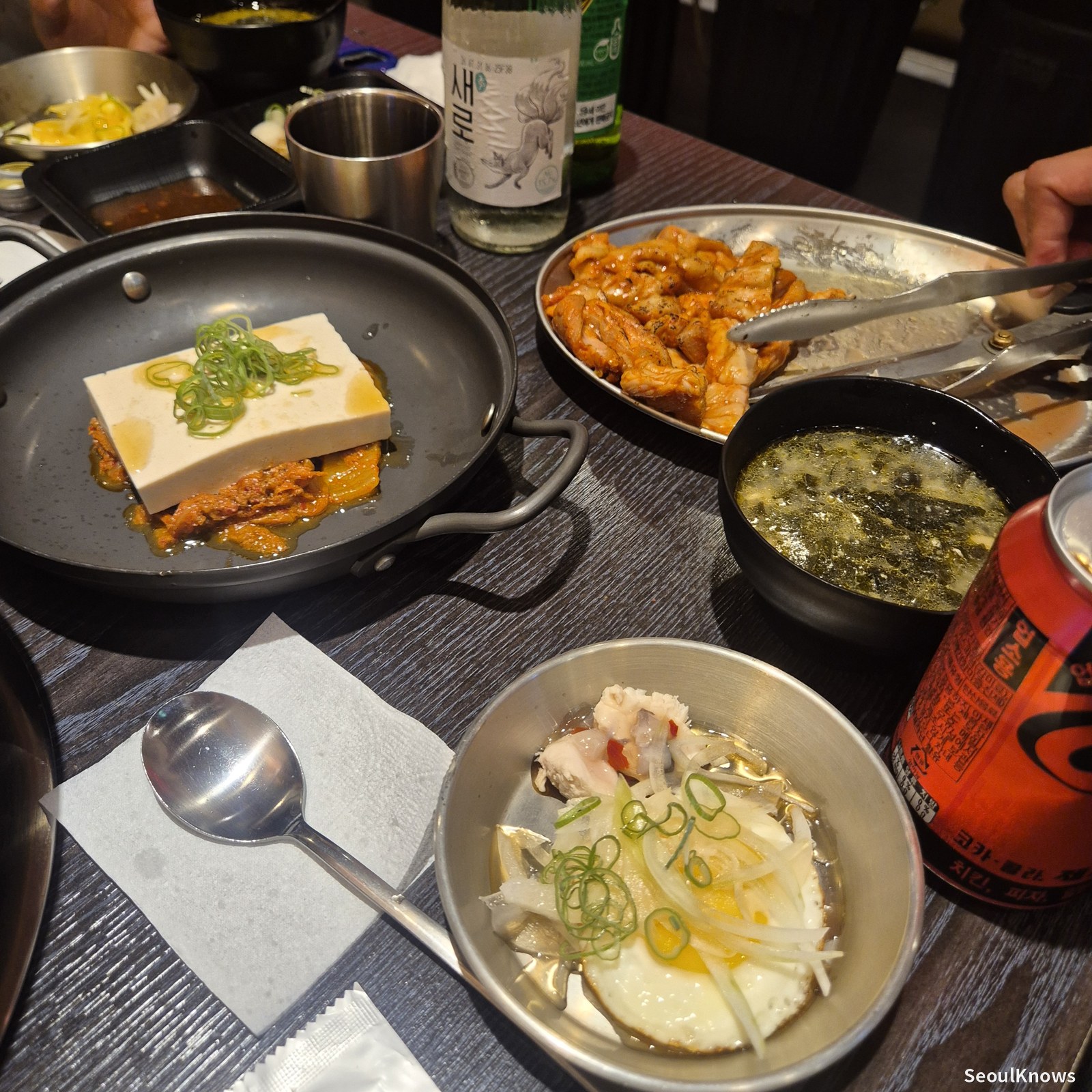 Grilled tofu kimchi and side dishes at Wolgyerang