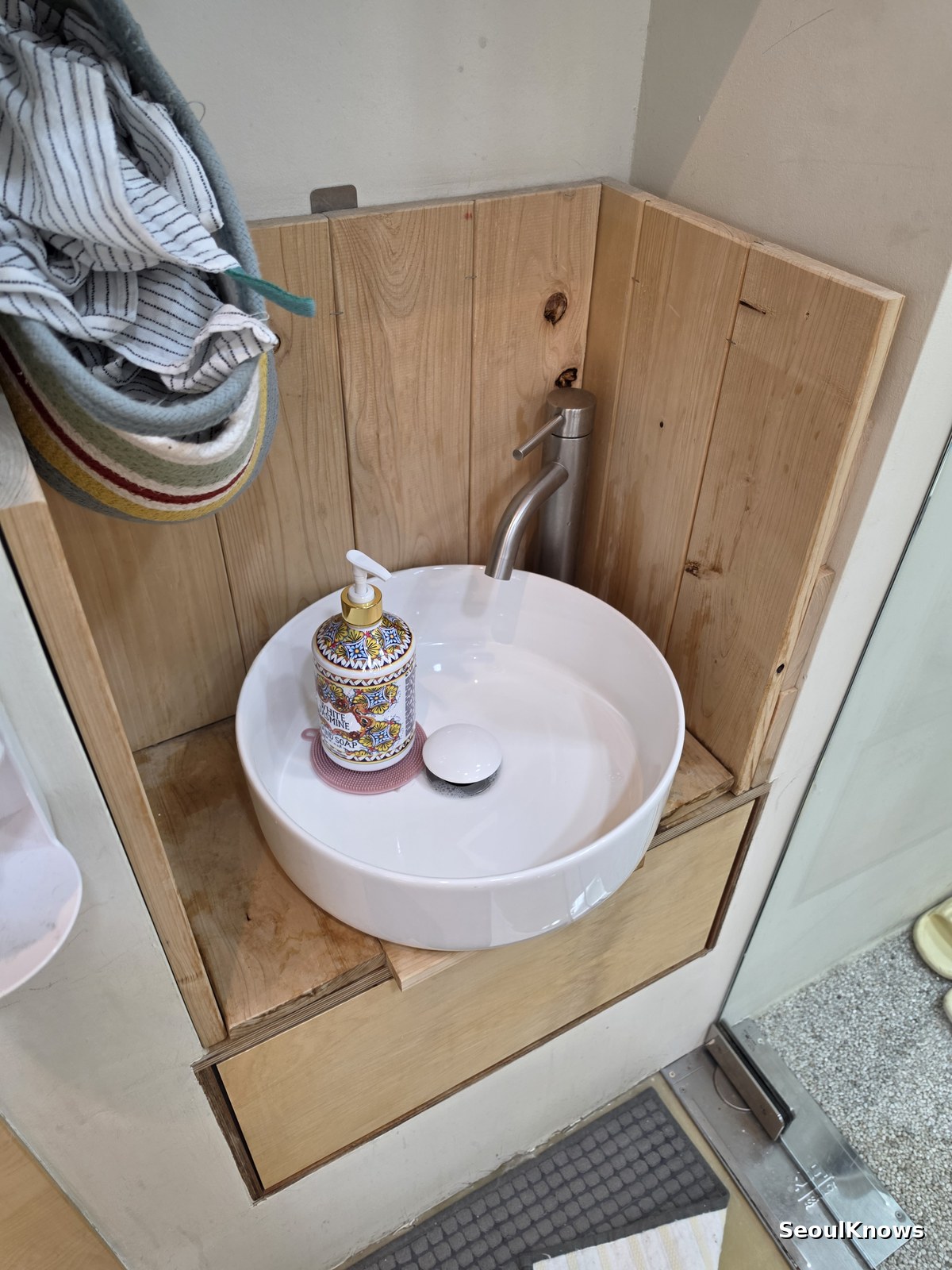Hand washing sink at the entrance of a Korean cat cafe