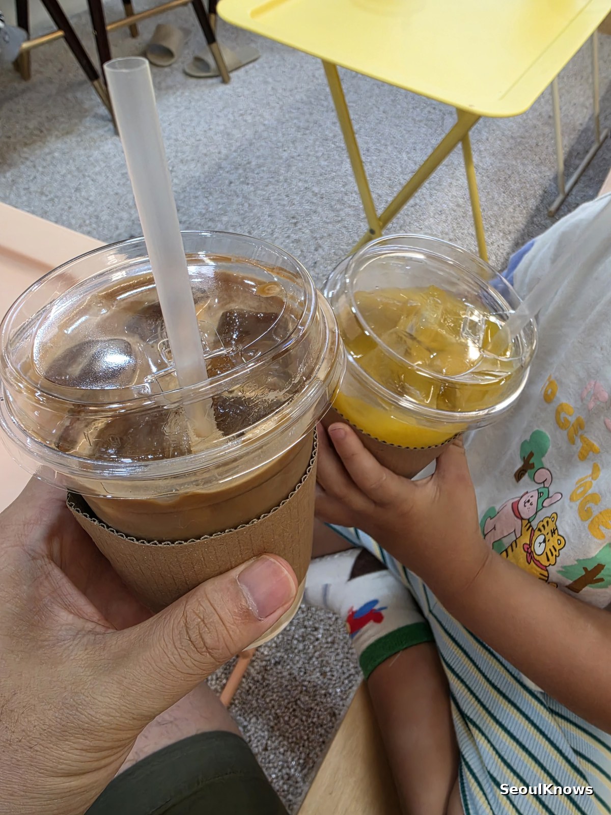 Iced coffee and orange ade included with cat cafe entry in Korea
