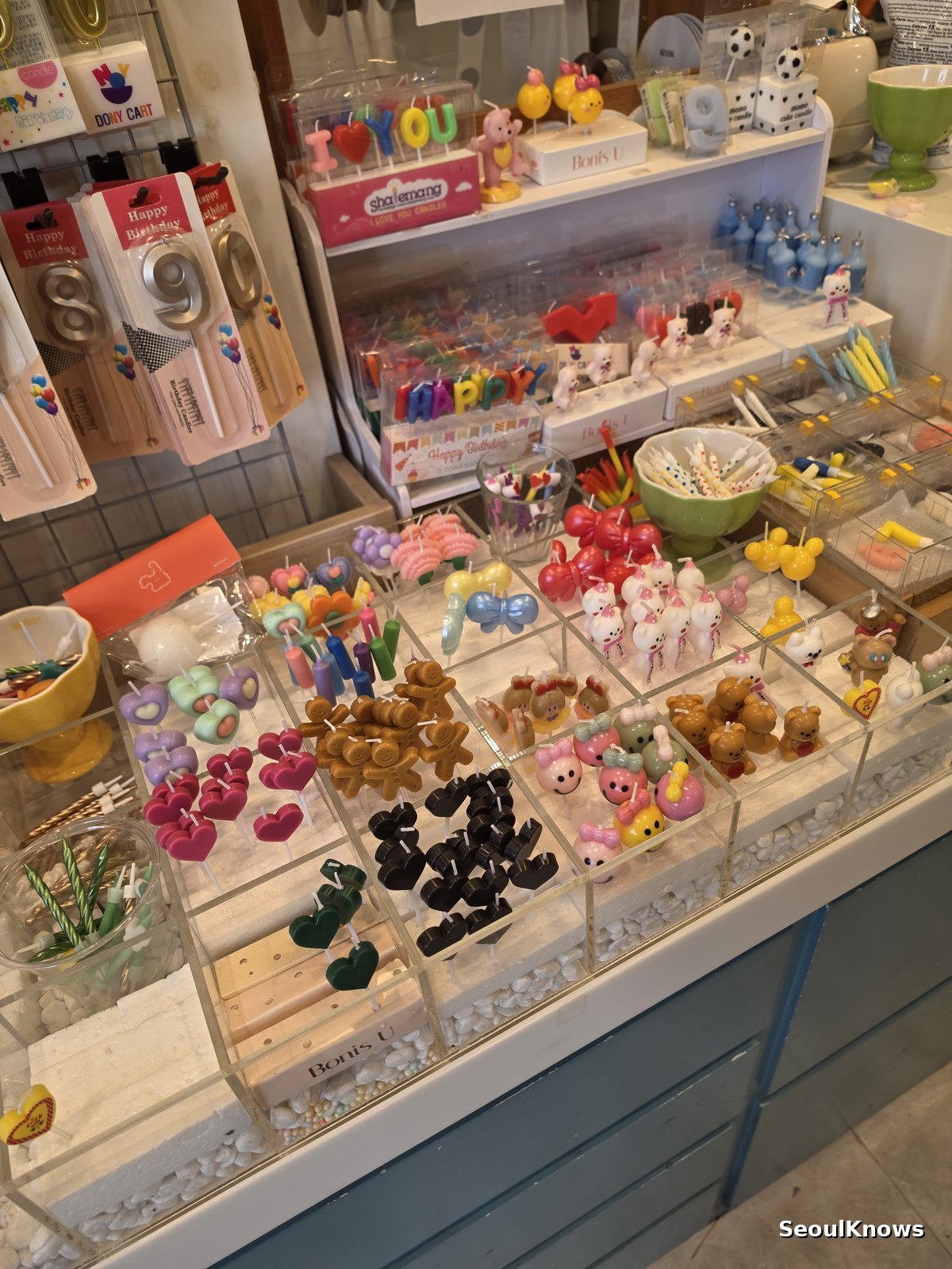 Cake toppers and decorations displayed at a custom cake shop in Seoul