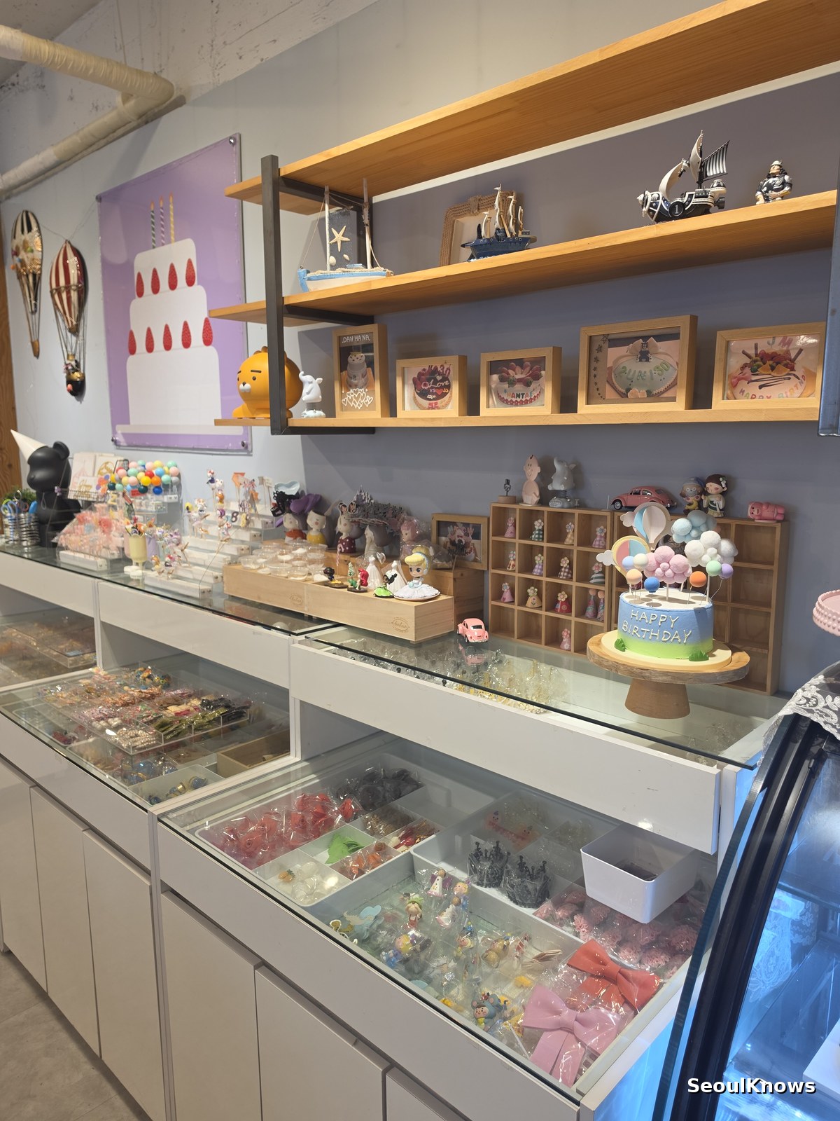 Display shelves and cake fridge inside a made to order cake shop in Korea