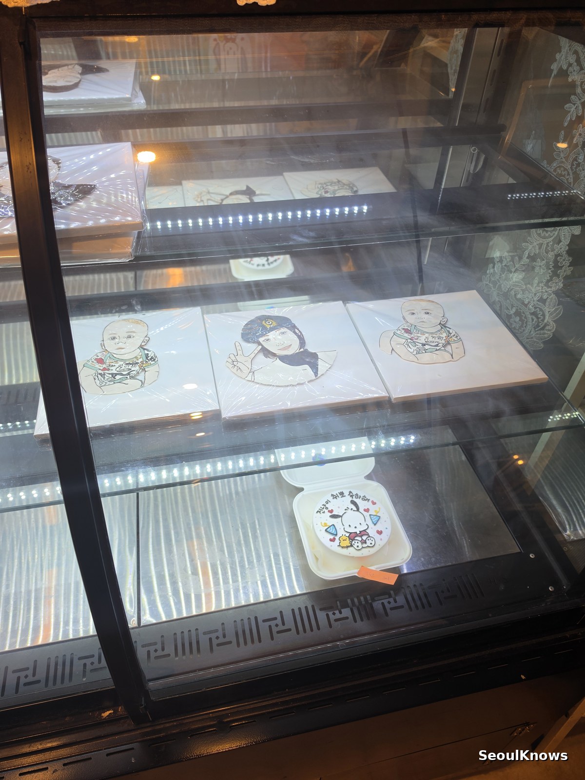 Lunchbox cakes displayed in the fridge of a custom cake shop in Seoul
