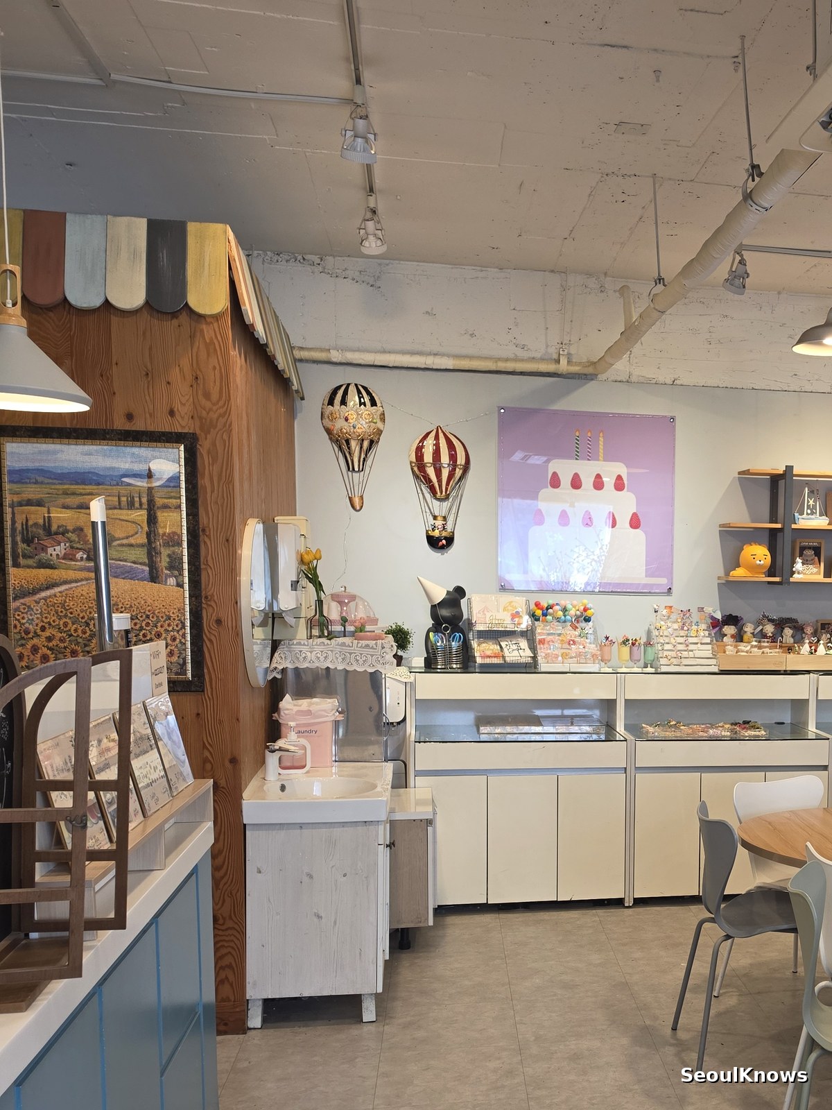 Small Seoul cake shop with a consultation table and showcase