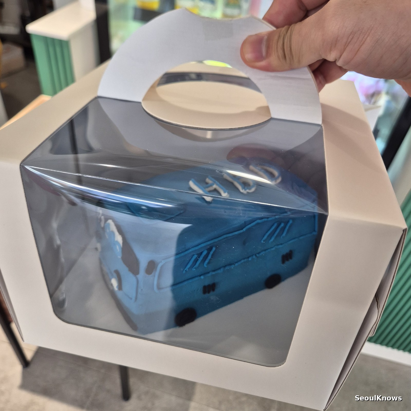 Character cake boxed for transport from a custom cake studio in Seoul