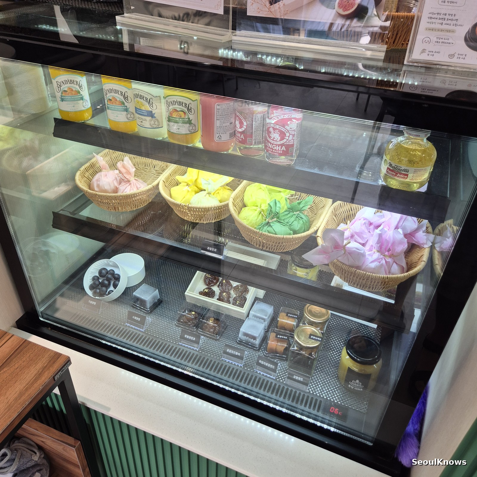 Traditional Korean sweets counter with yanggaeng jeonggwa and dried persimmon rolls