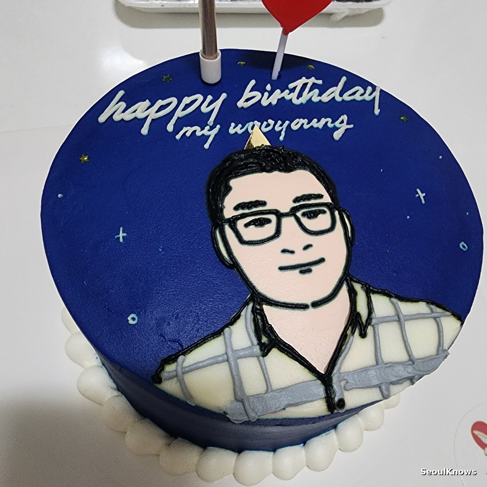 Portrait caricature cake made to order in Seoul with hand piped face