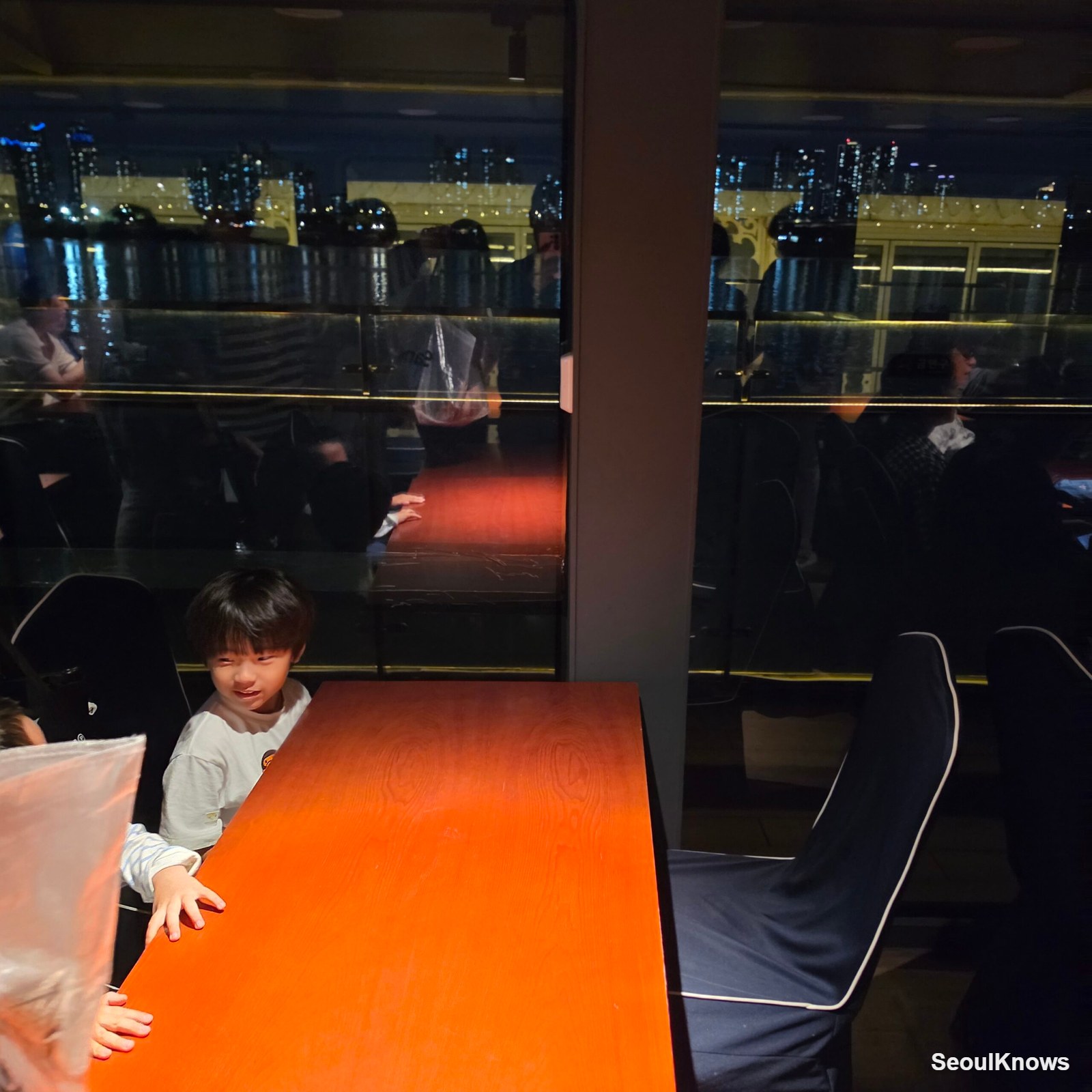 Indoor window table seating on the Han River cruise boat