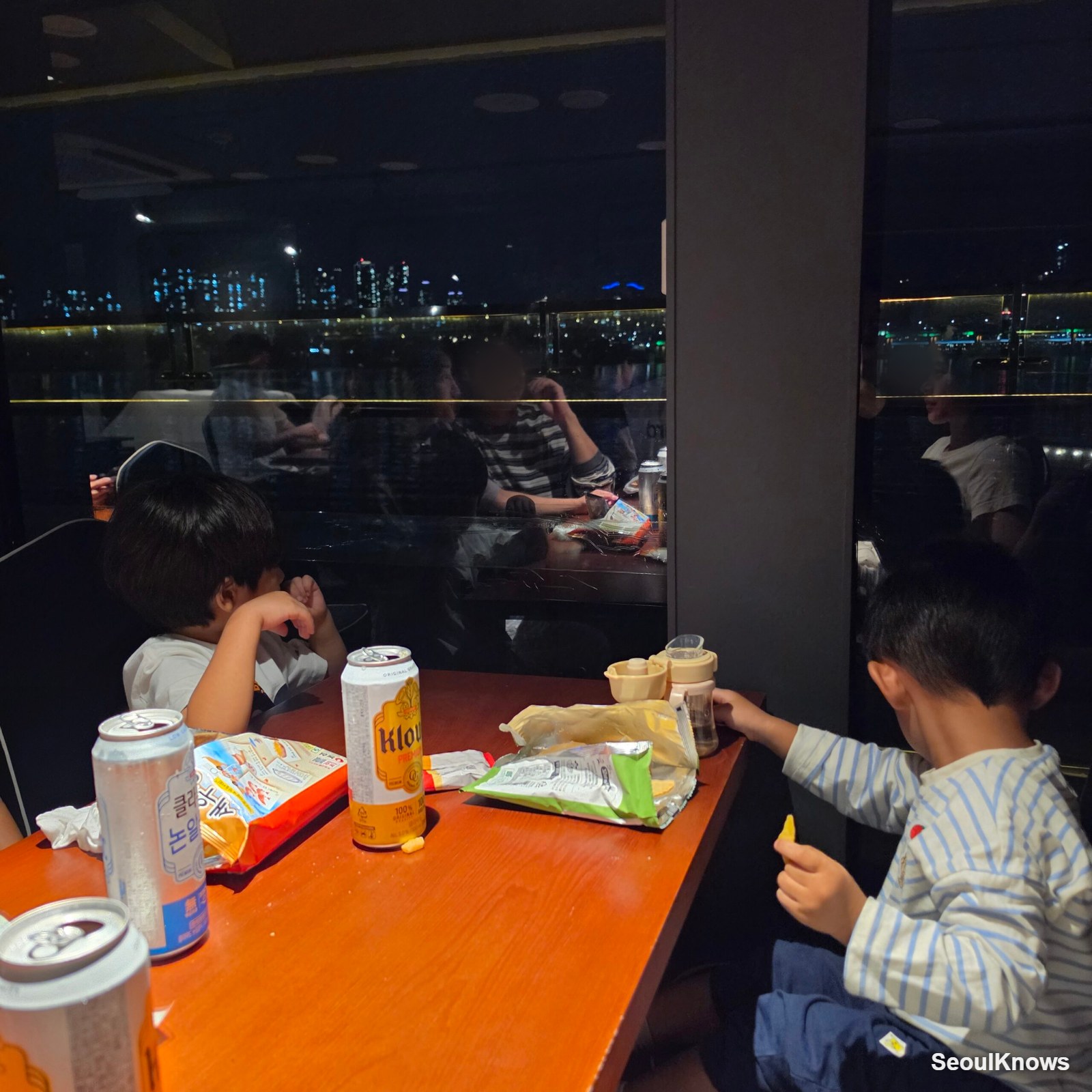 Snacks on the table at a window seat on the Han River night cruise