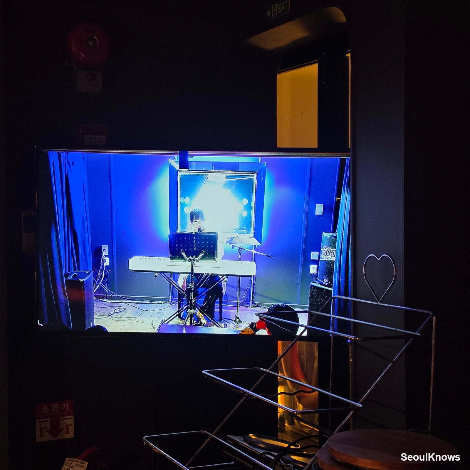 Live music performance relayed on a screen aboard the Moonlight Music Cruise