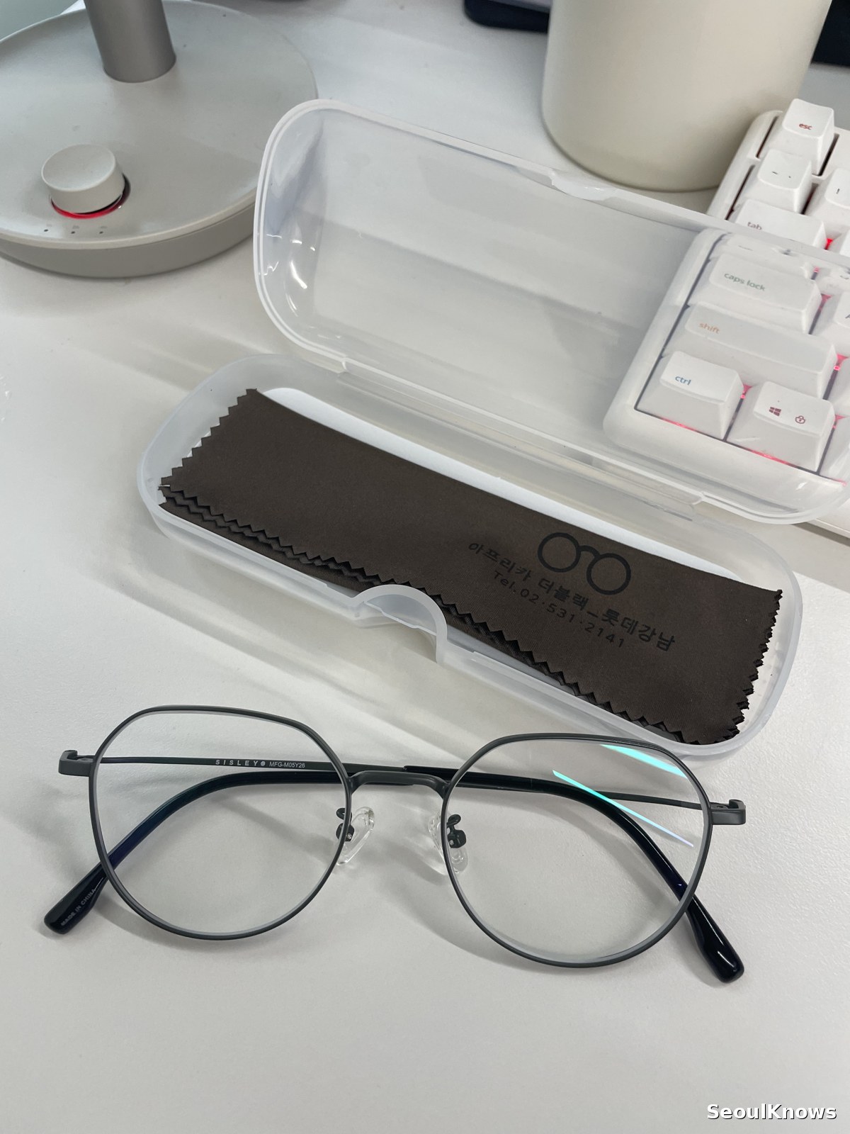 Finished prescription glasses with case from a Korean optical shop