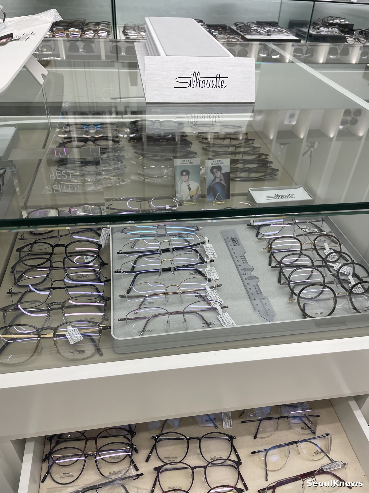 Frames arranged in a display case at a Korean optical shop