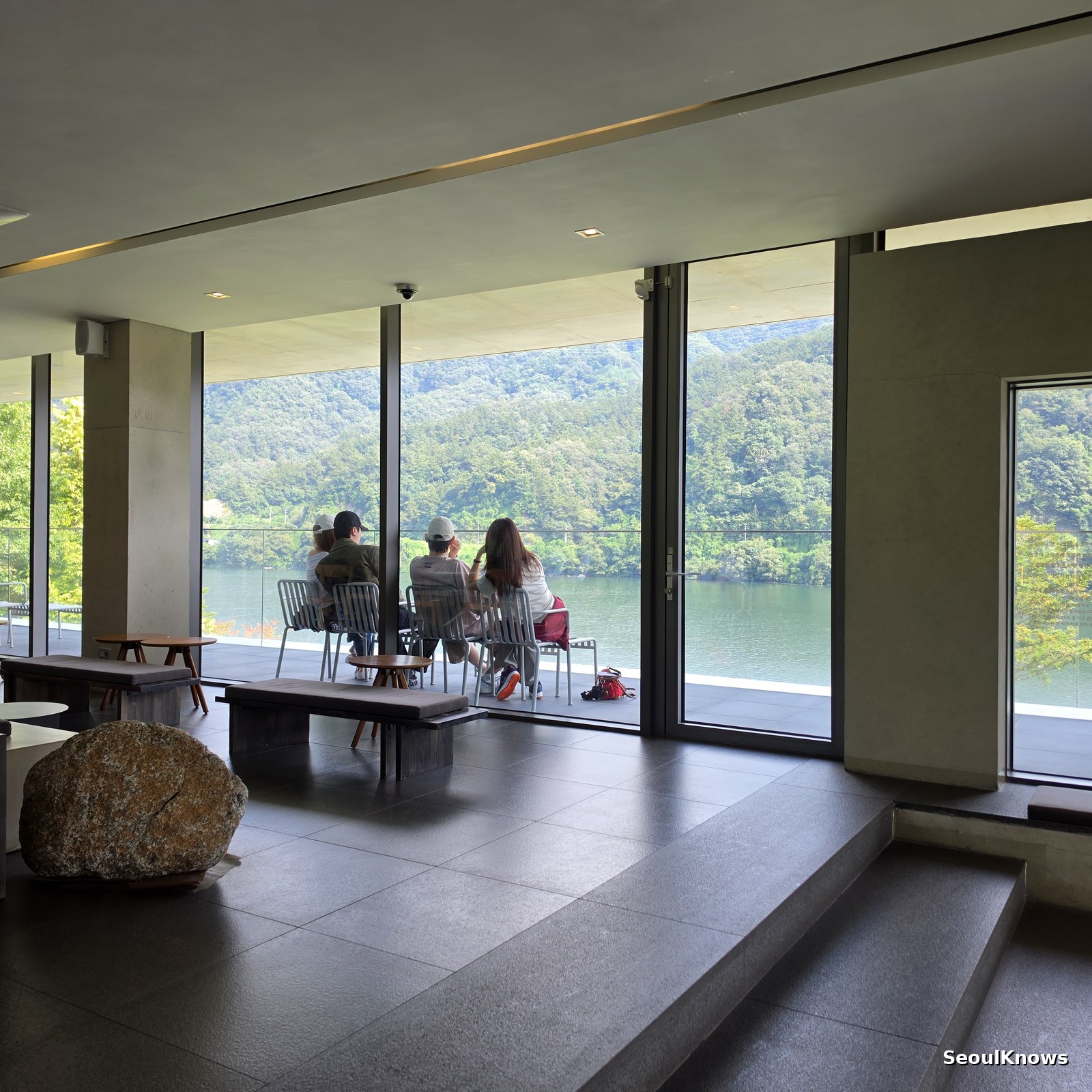 Guests sitting on the riverside terrace at Golden Tree cafe Gapyeong