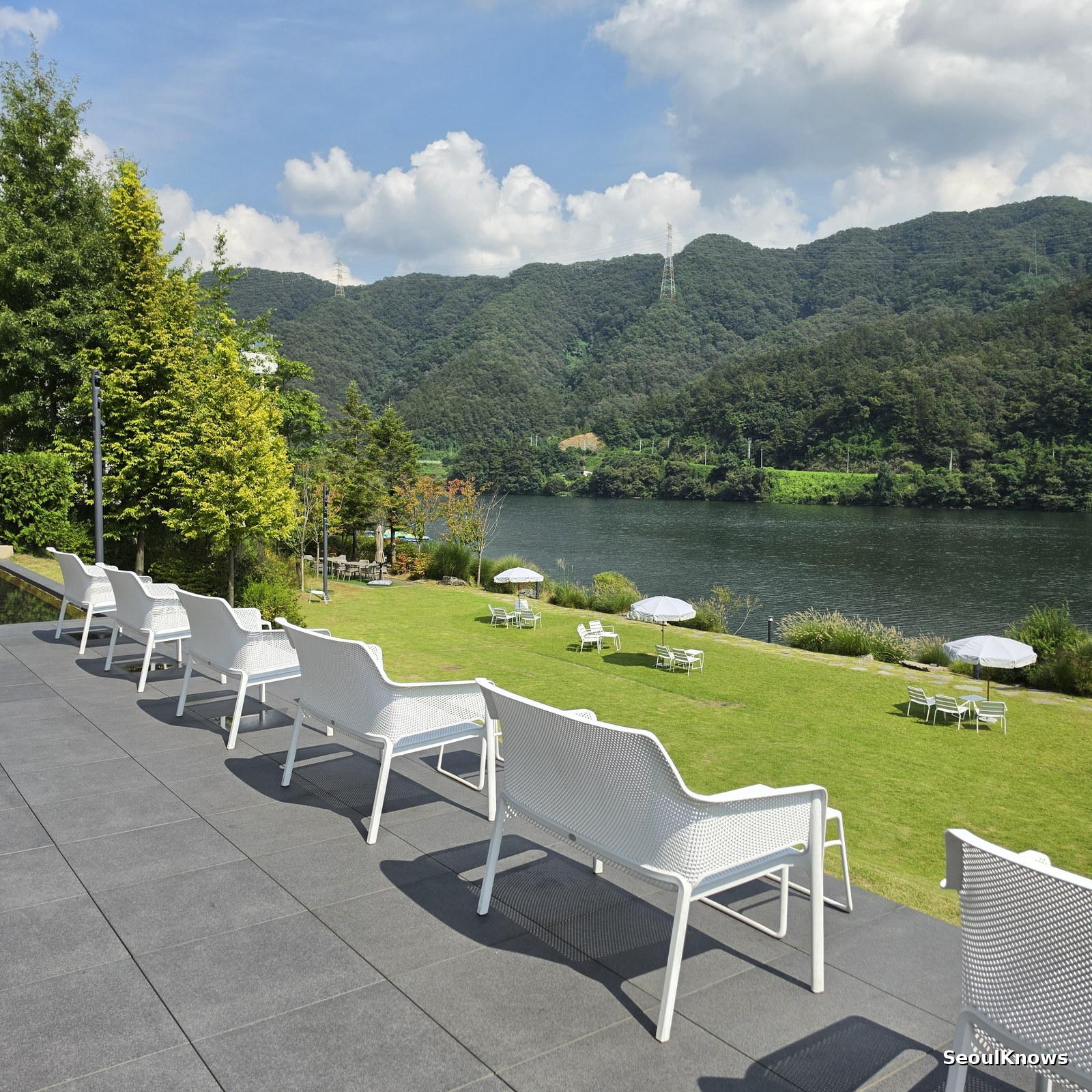 White loungers on the award winning lawn at Golden Tree cafe Gapyeong