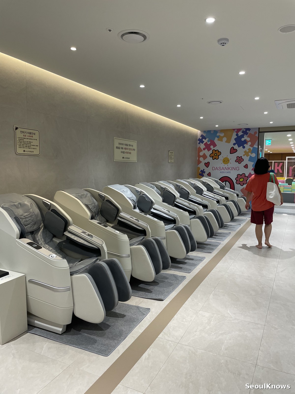 Row of massage chairs in a Korean jjimjilbang