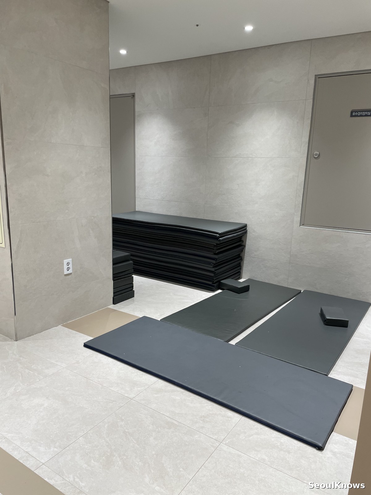 Mats laid out on a heated floor in a Korean spa