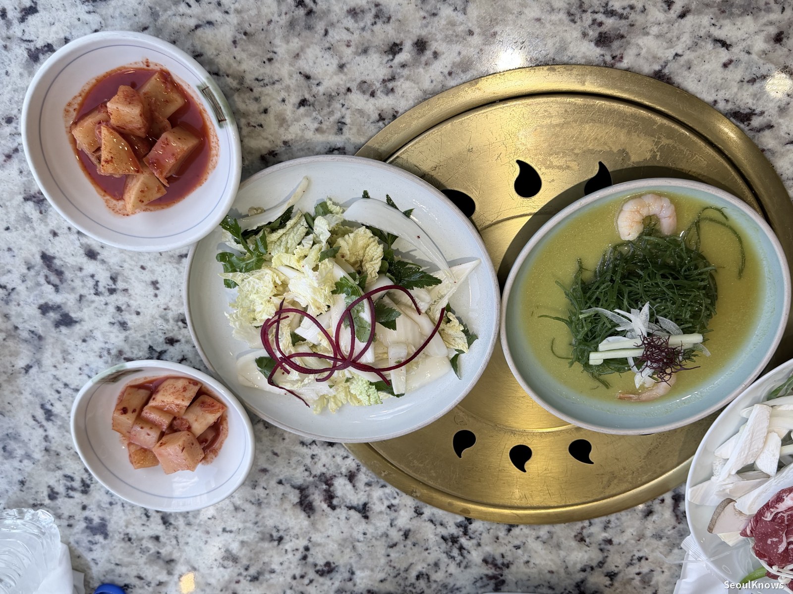 Fresh geotjeori cabbage kimchi and seaweed salad