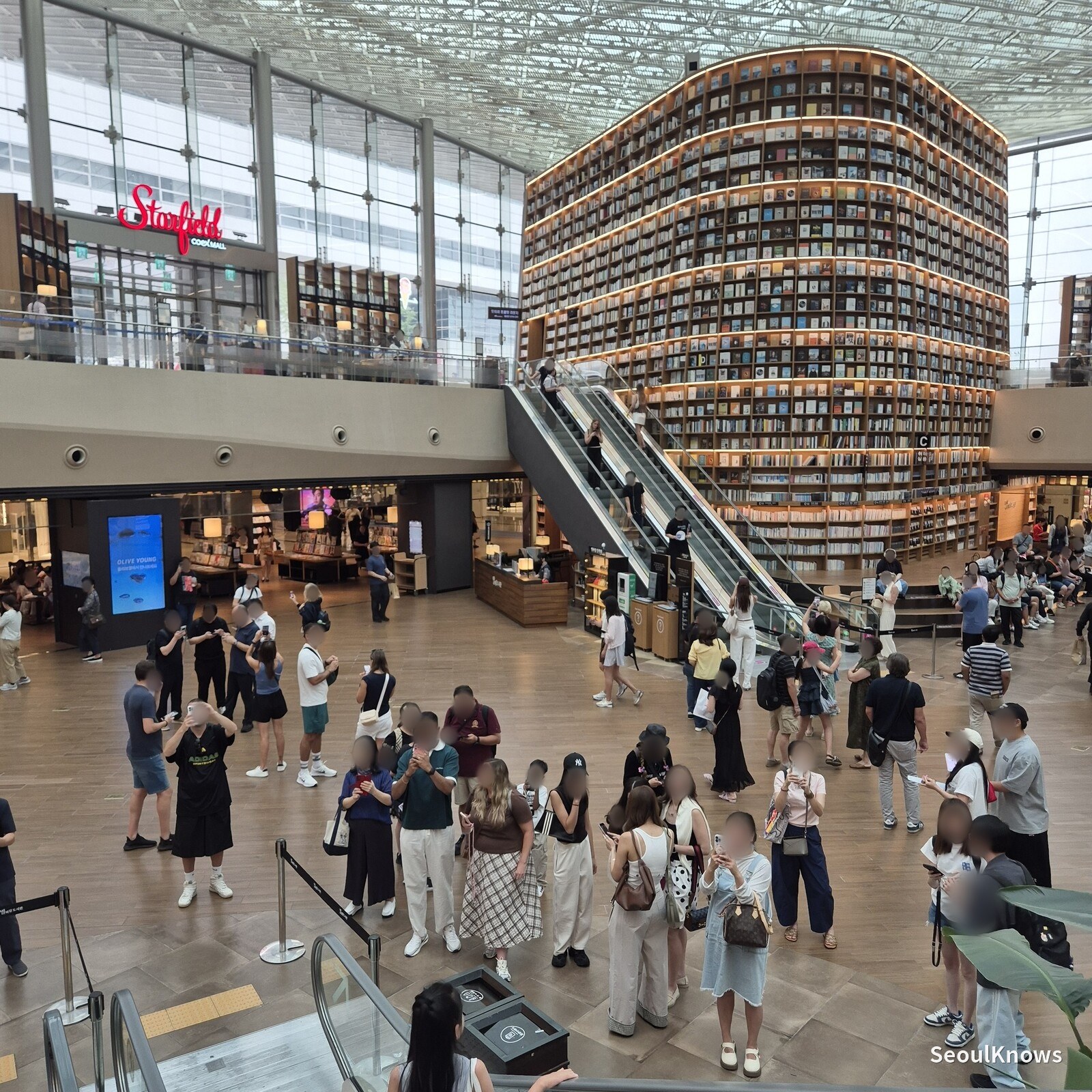 Visitors queueing to photograph each other at Starfield Library COEX