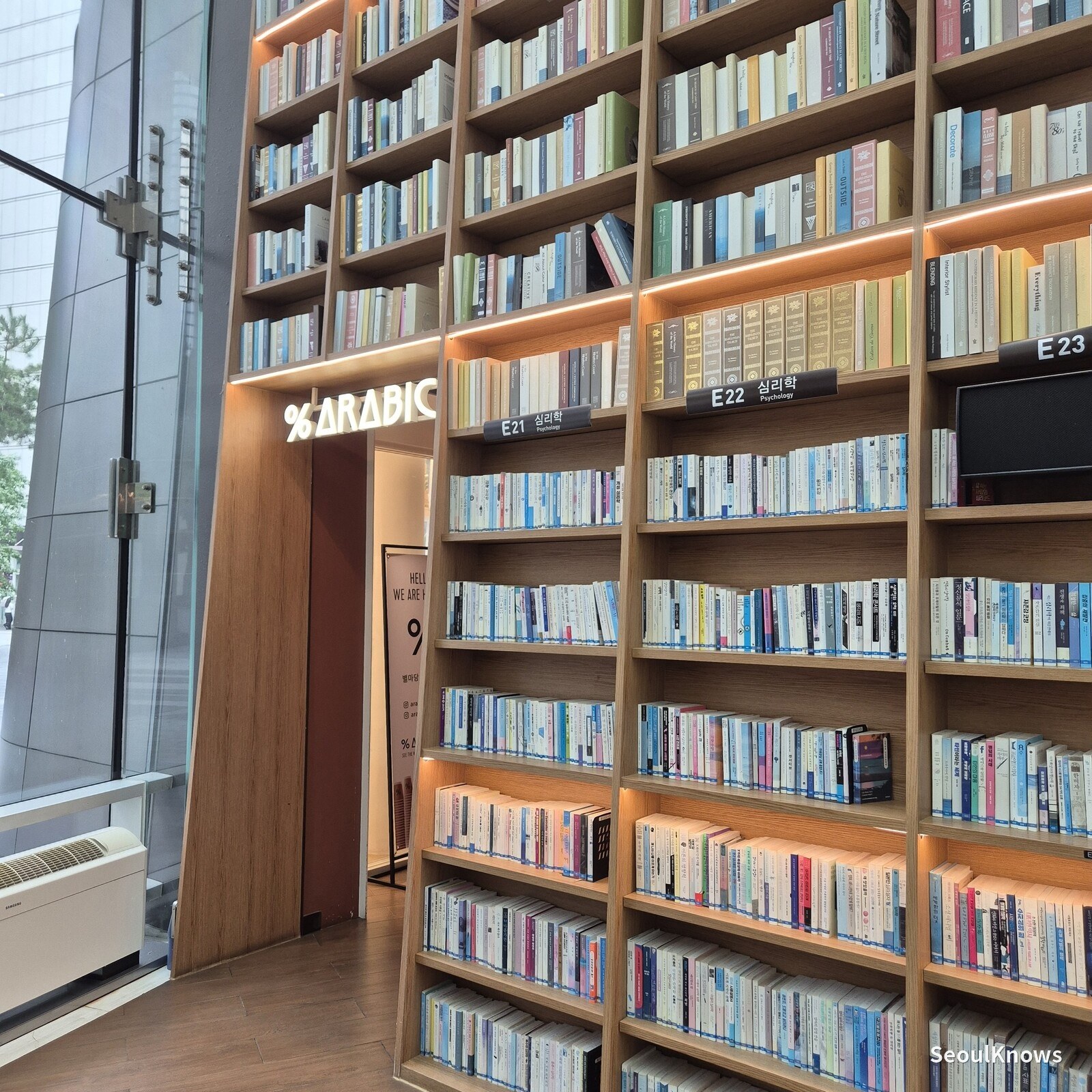 % Arabica signage beside the bookshelves at Starfield Library COEX