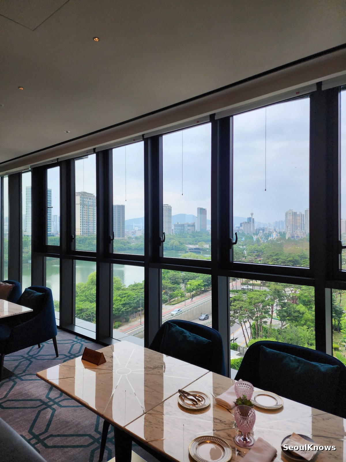 View of Seokchon Lake and Lotte World Magic Island from L'Espace lounge sixth floor
