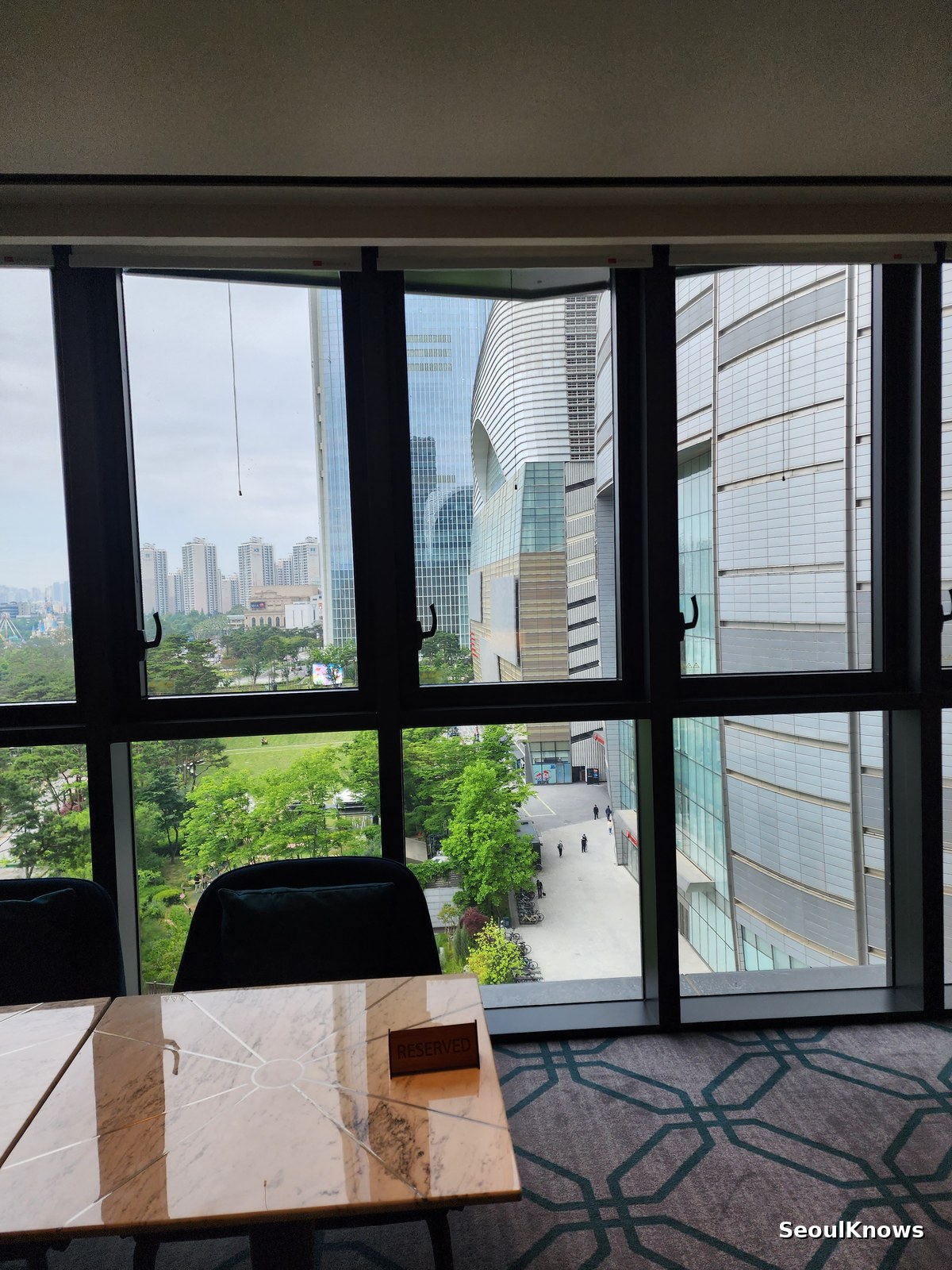 Lotte World Mall complex seen from a window table at L'Espace Sofitel Ambassador Seoul