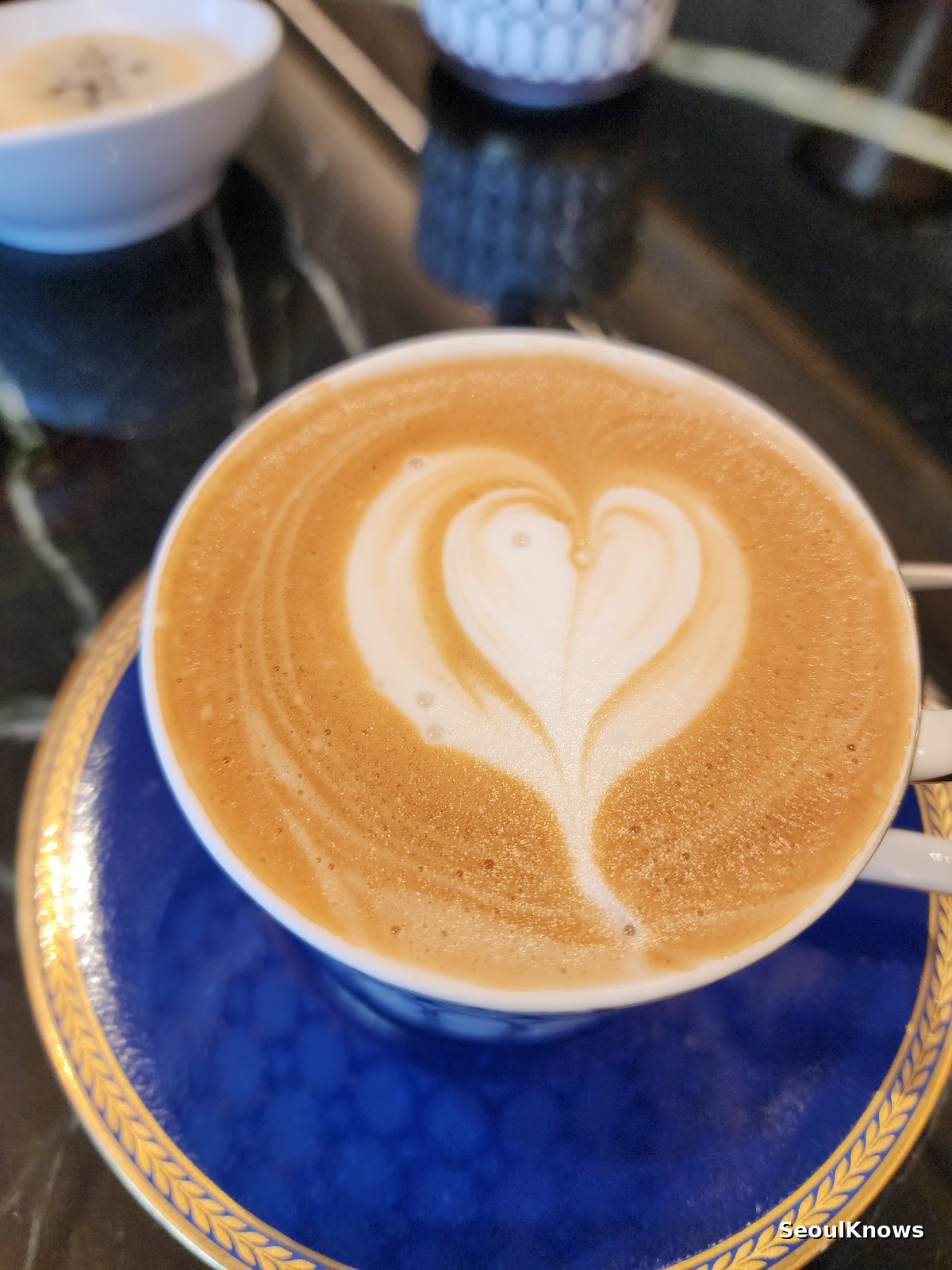 Close up of heart latte art in a Wedgwood bone china cup at a Seoul hotel lounge