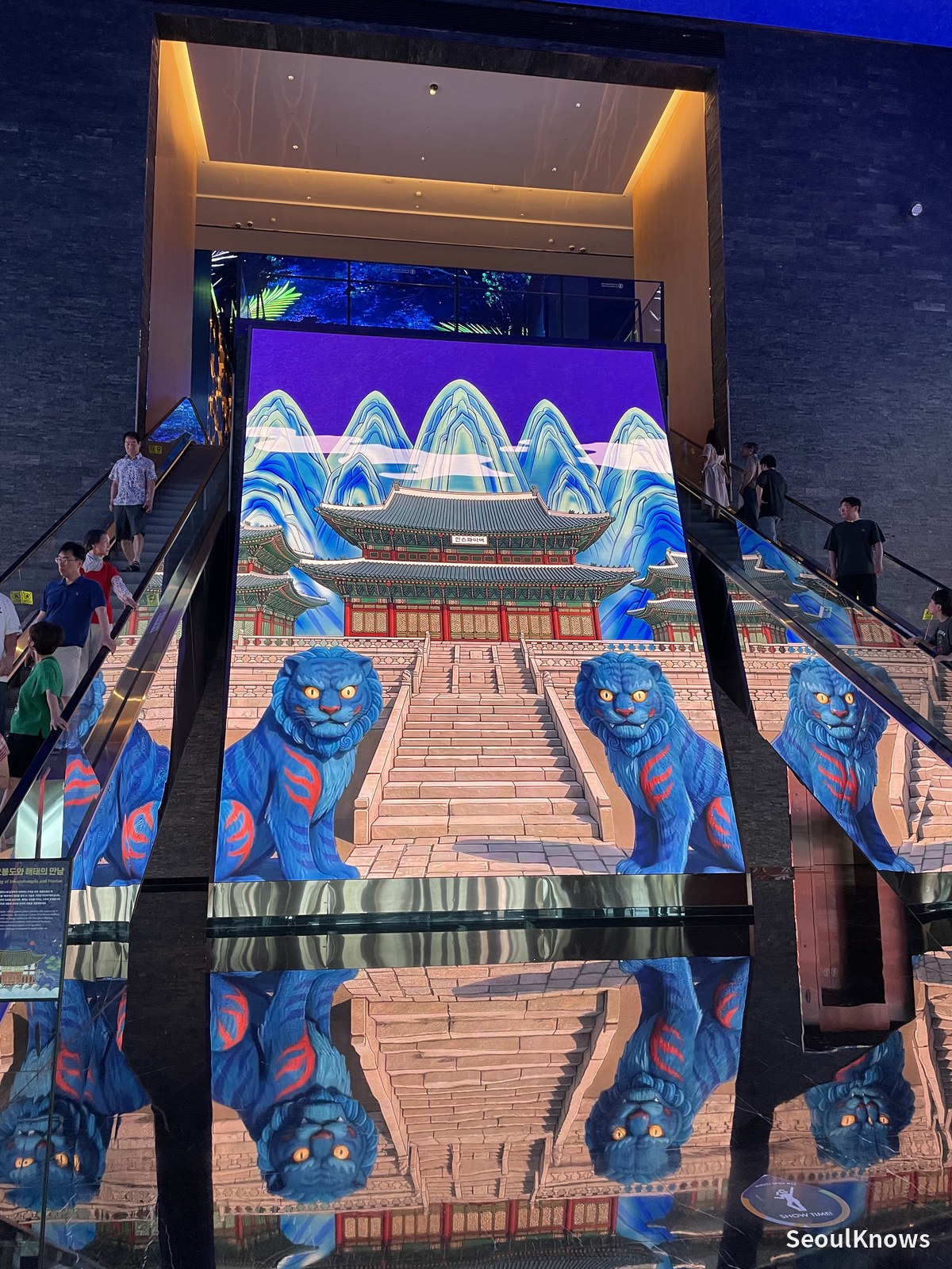 Korean folk art tiger mural on the escalator staircase at Inspire